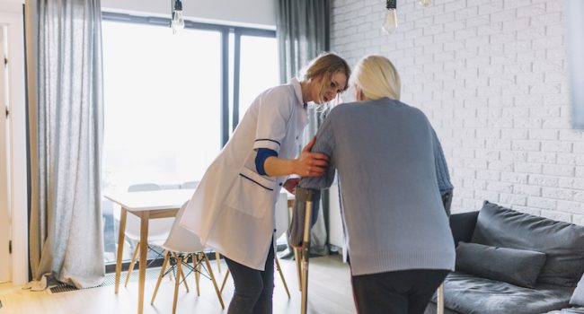 Woman and nurse in retirement home